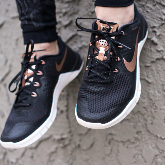 black and rose gold nike trainers